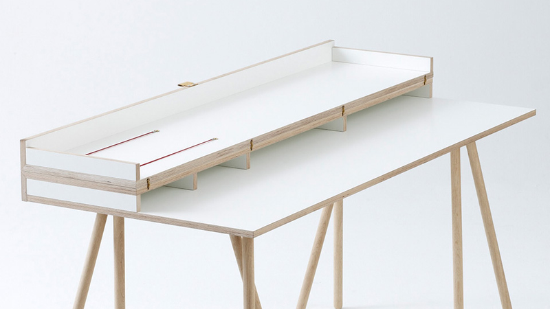 Illustration for article titled Transforming Desk Hides Your Work When It's Time To Dine